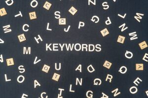 Keywords word written on dark paper background. Keywords text for your concepts
